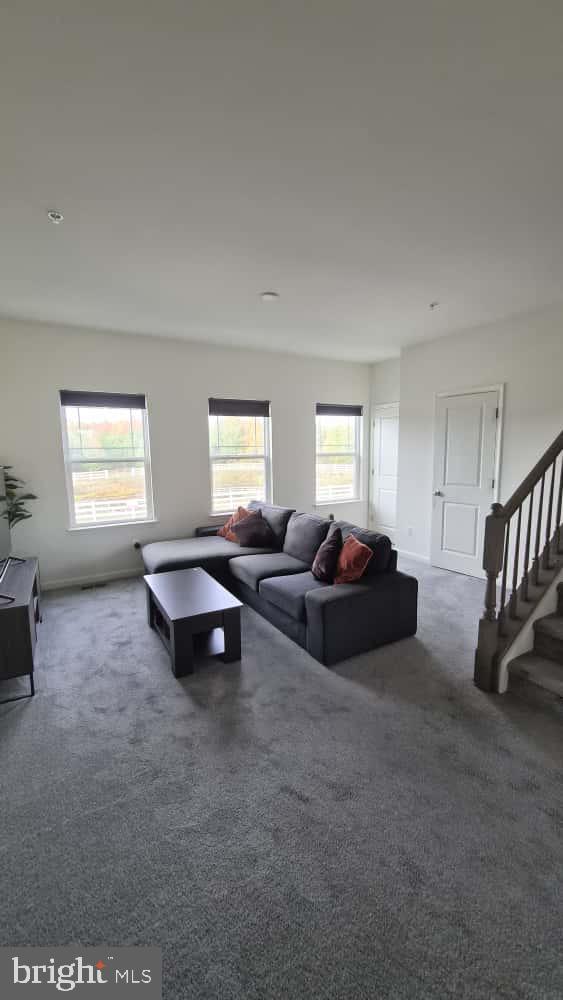 2488 Westwind Boulevard Cambridge, MD 21613 - Photo 17 of 32 a living room with furniture and a window