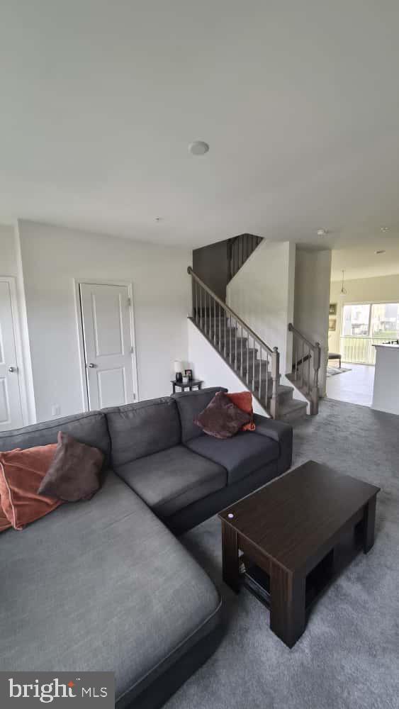 2488 Westwind Boulevard Cambridge, MD 21613 - Photo 18 of 32 a living room with furniture and a wooden floor