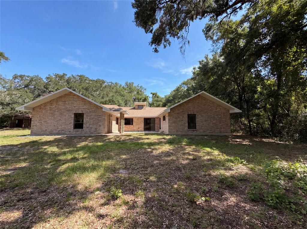 3739 Lake Griffin Road Lady Lake, FL 32159 - Photo 21 of 21 a view of a house with a yard