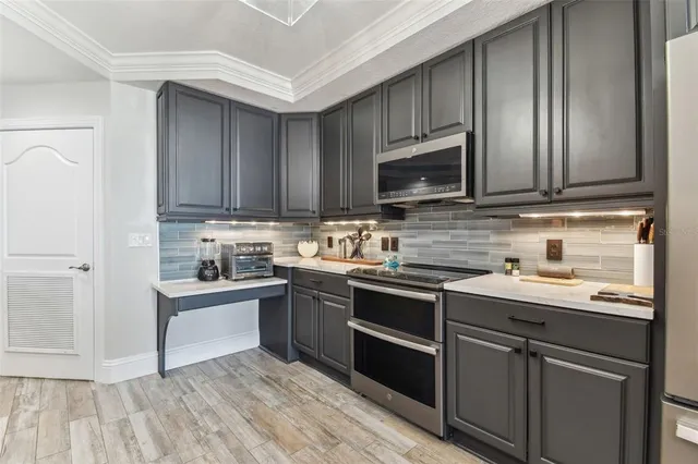 a bathroom with a granite countertop sink a shower and a mirror