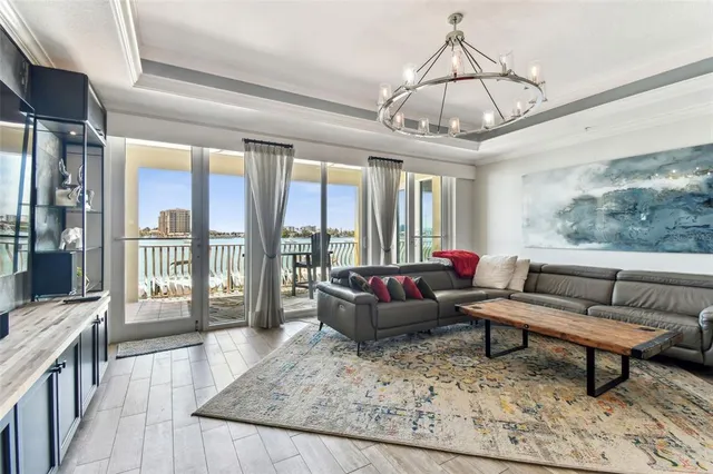 a bedroom with a large bed and a large window