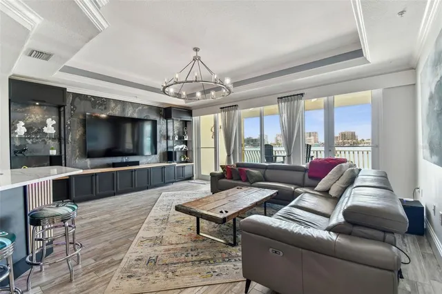 a bedroom with a bed and large window