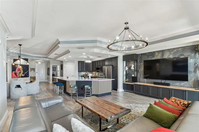 a bedroom with a large bed and a glass door