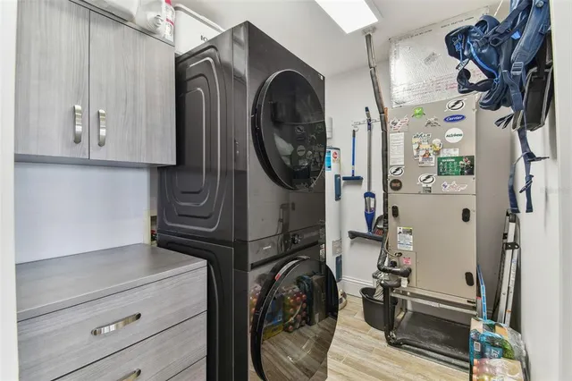 a view of a lake with couches chairs and city view