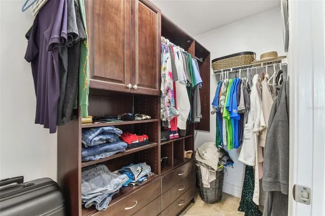 a living room with furniture a large window and a flat screen tv