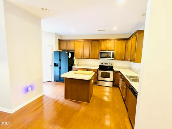 a kitchen with granite countertop a sink and counter top space