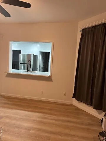 a view of a livingroom with wooden floor