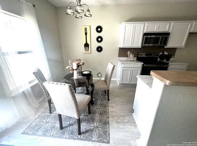 a kitchen with a sink stove and refrigerator