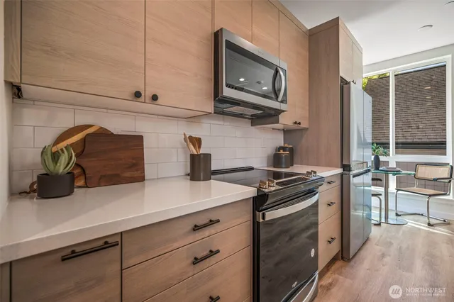 a kitchen with a stove and a microwave