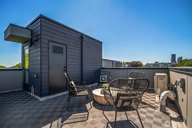 a front view of a house with table and chairs