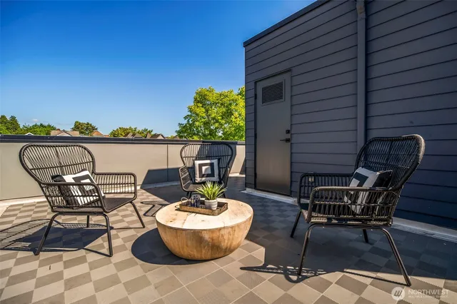 a view of a patio with table and chairs and potted plants