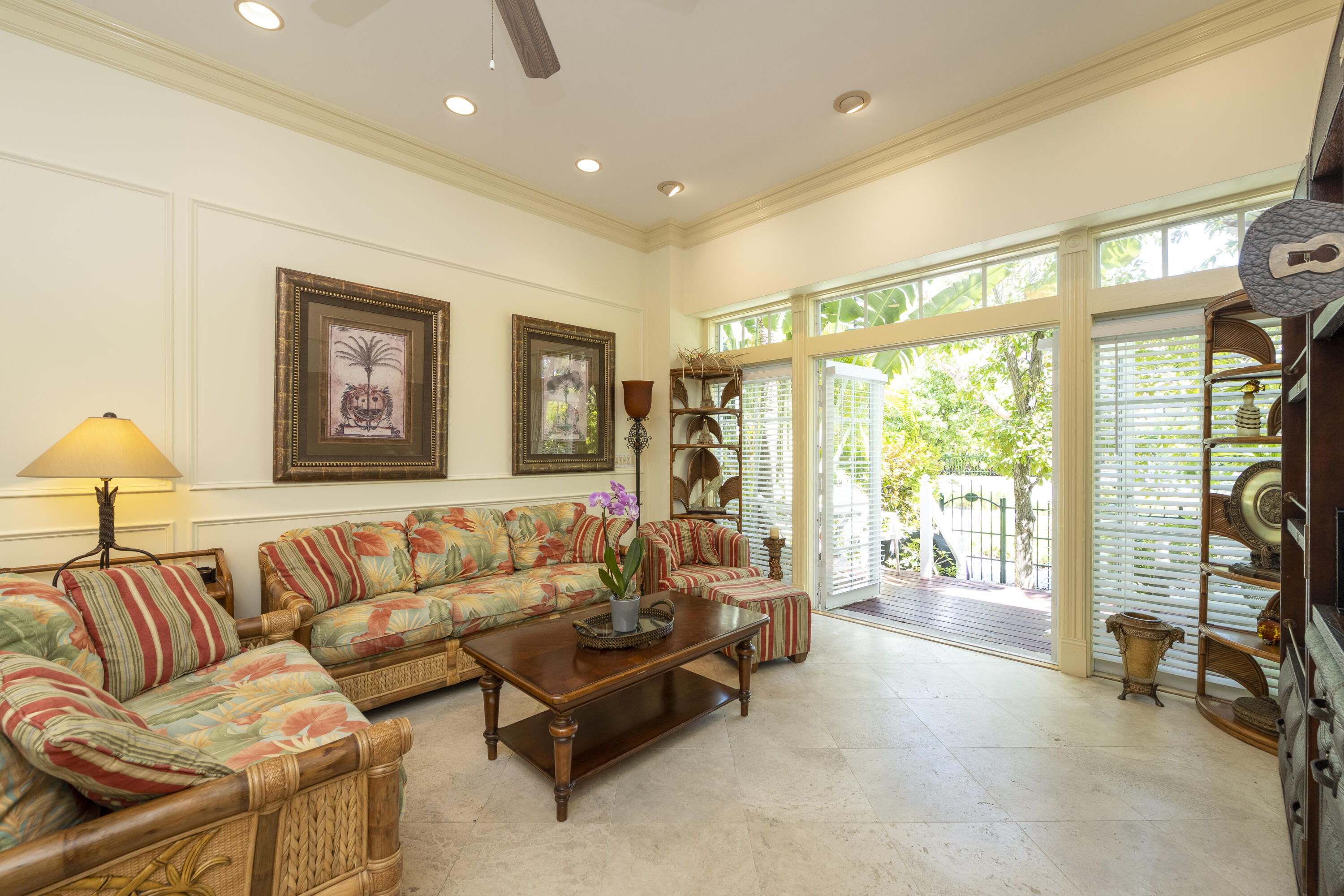 101 Front Street, Unit 5 Key West, FL 33040 - Photo 13 of 36 a living room with furniture and a flat screen tv