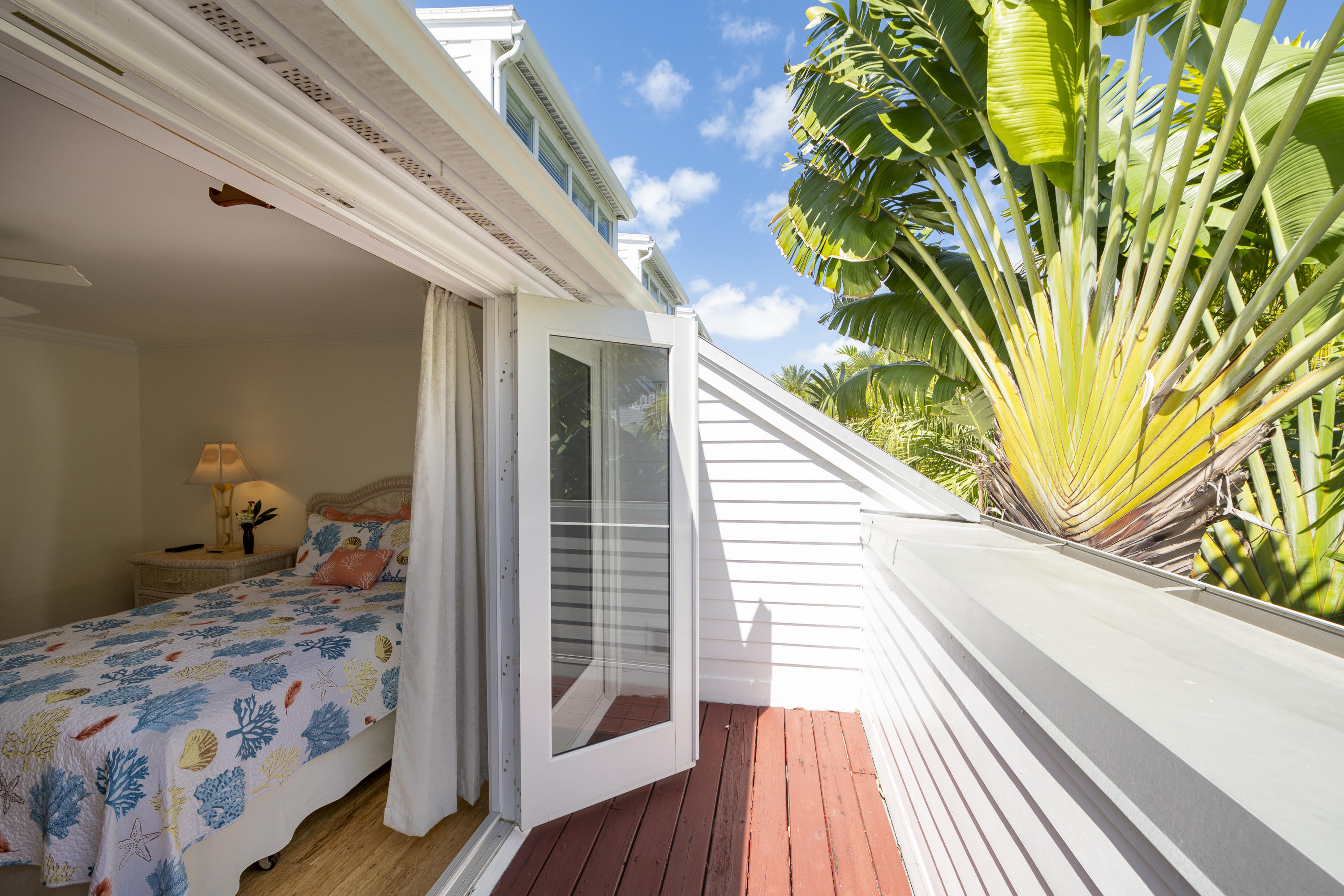 101 Front Street, Unit 5 Key West, FL 33040 - Photo 16 of 36 a balcony view with a bed