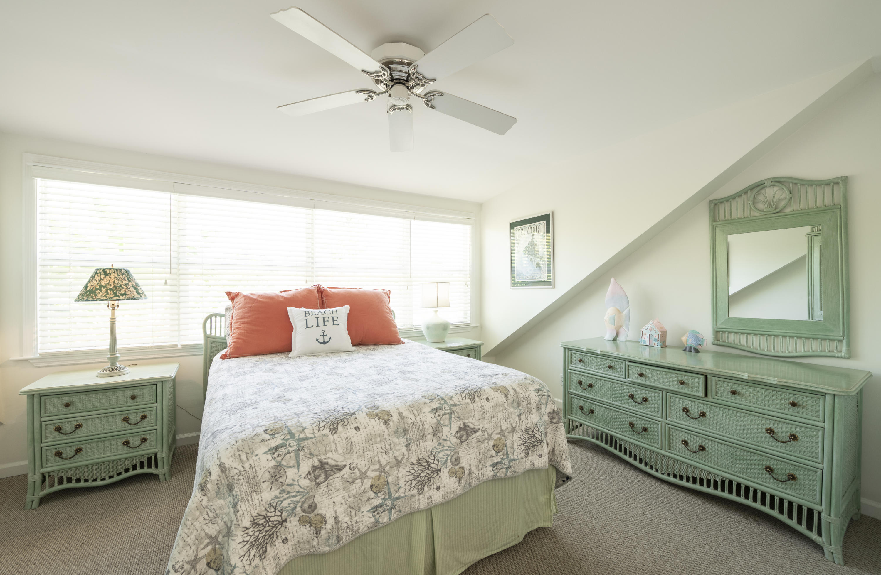 101 Front Street, Unit 5 Key West, FL 33040 - Photo 20 of 36 a bedroom with a bed and a chandelier