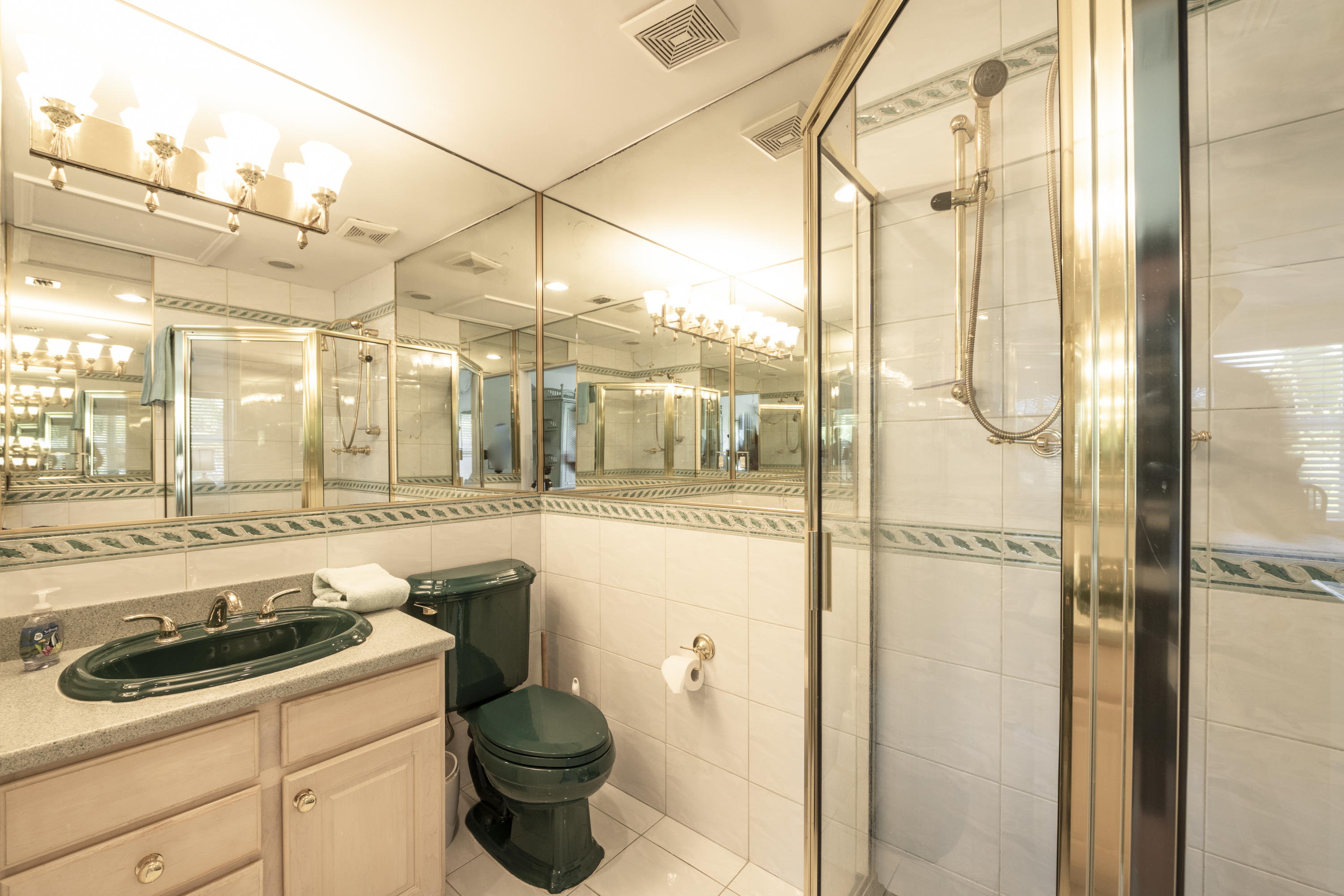 101 Front Street, Unit 5 Key West, FL 33040 - Photo 22 of 36 a bathroom with a sink and a washing machine
