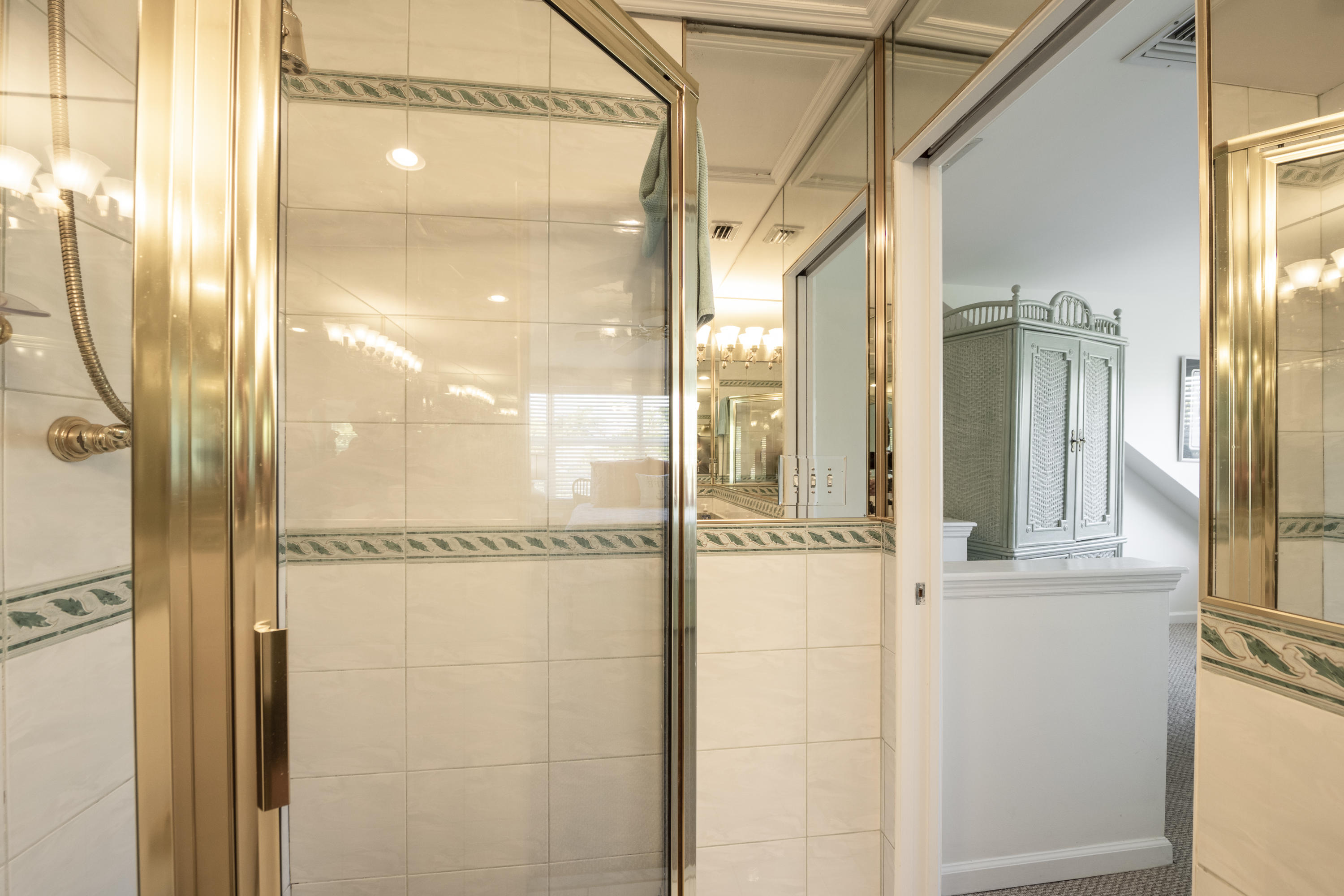 101 Front Street, Unit 5 Key West, FL 33040 - Photo 23 of 36 a bathroom with a glass shower door and a glass door