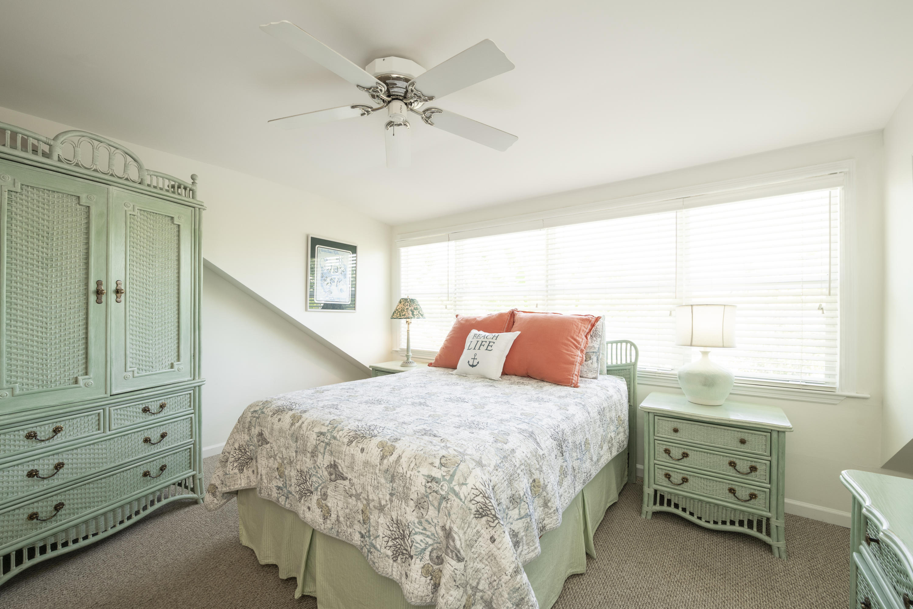 101 Front Street, Unit 5 Key West, FL 33040 - Photo 24 of 36 a bedroom with a bed and a dresser