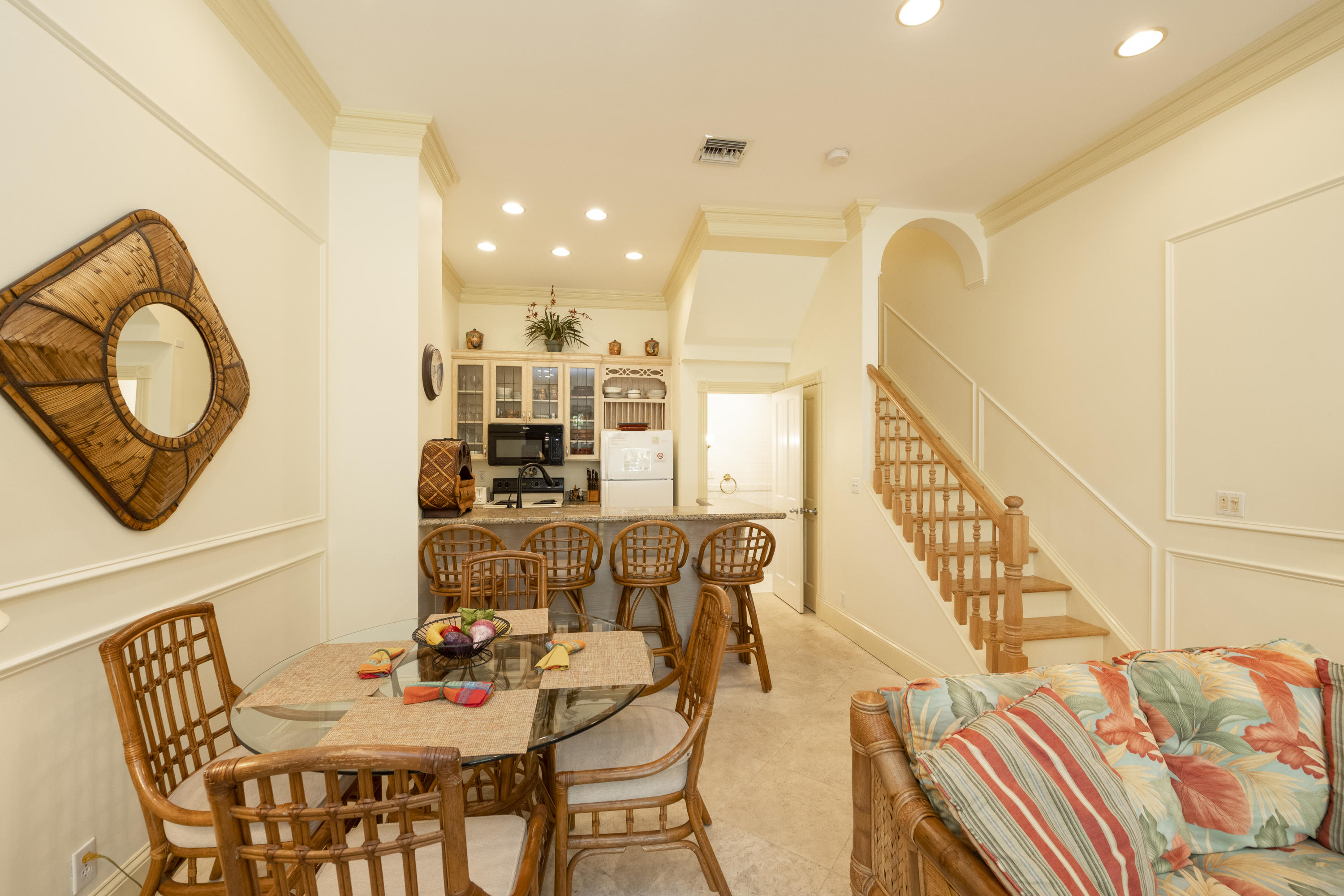 101 Front Street, Unit 5 Key West, FL 33040 - Photo 5 of 36 a view of a dining room with furniture and wooden floor