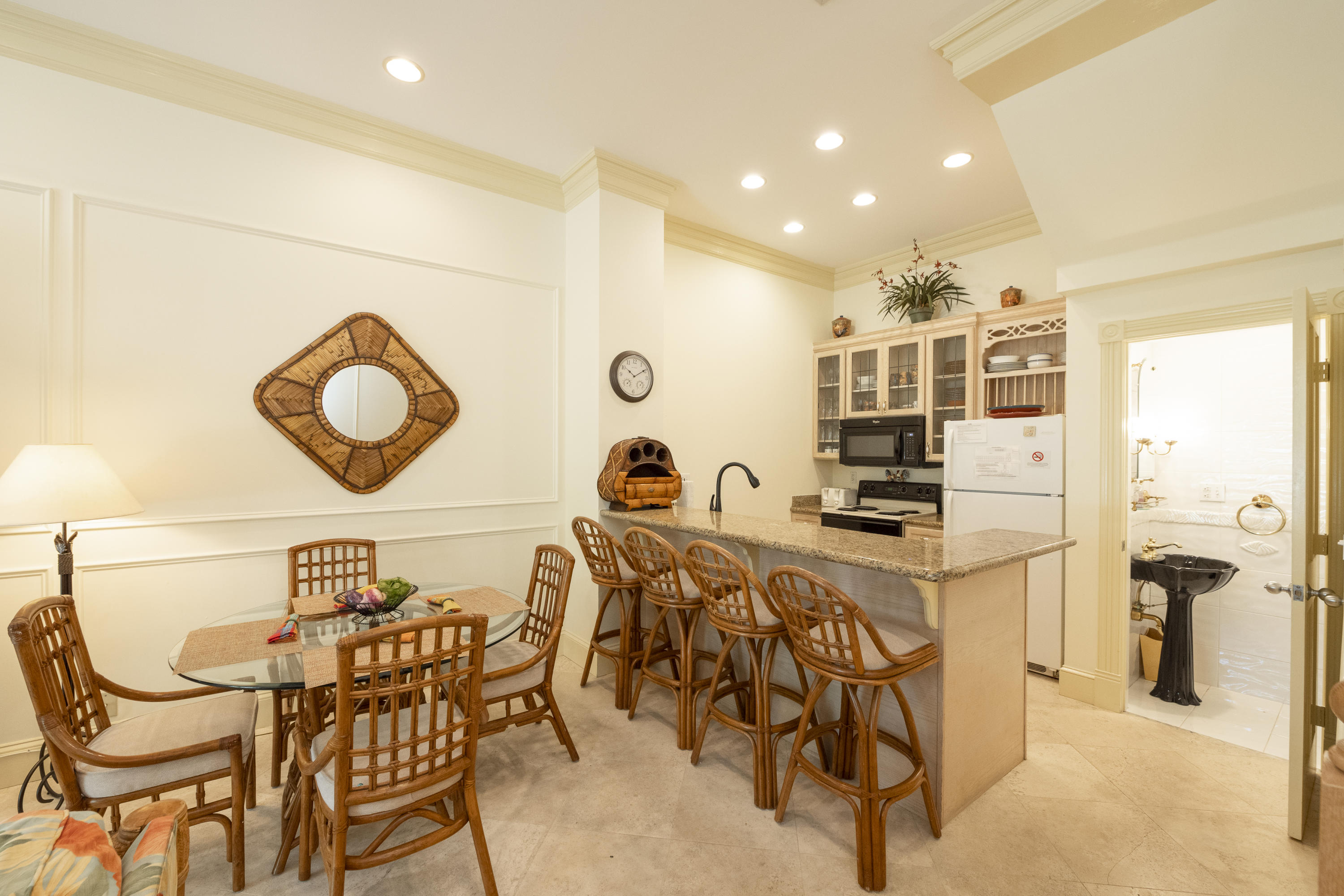 101 Front Street, Unit 5 Key West, FL 33040 - Photo 6 of 36 a view of a dining room with furniture and a chandelier