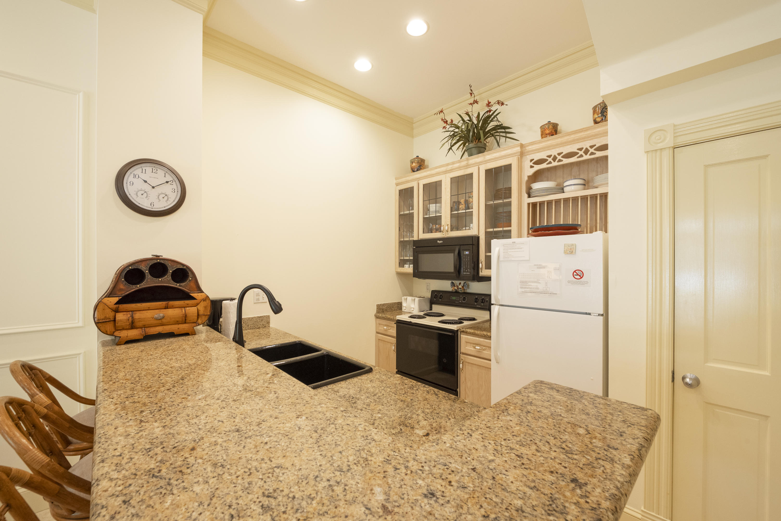 101 Front Street, Unit 5 Key West, FL 33040 - Photo 7 of 36 a kitchen with stainless steel appliances granite countertop a sink a stove and refrigerator