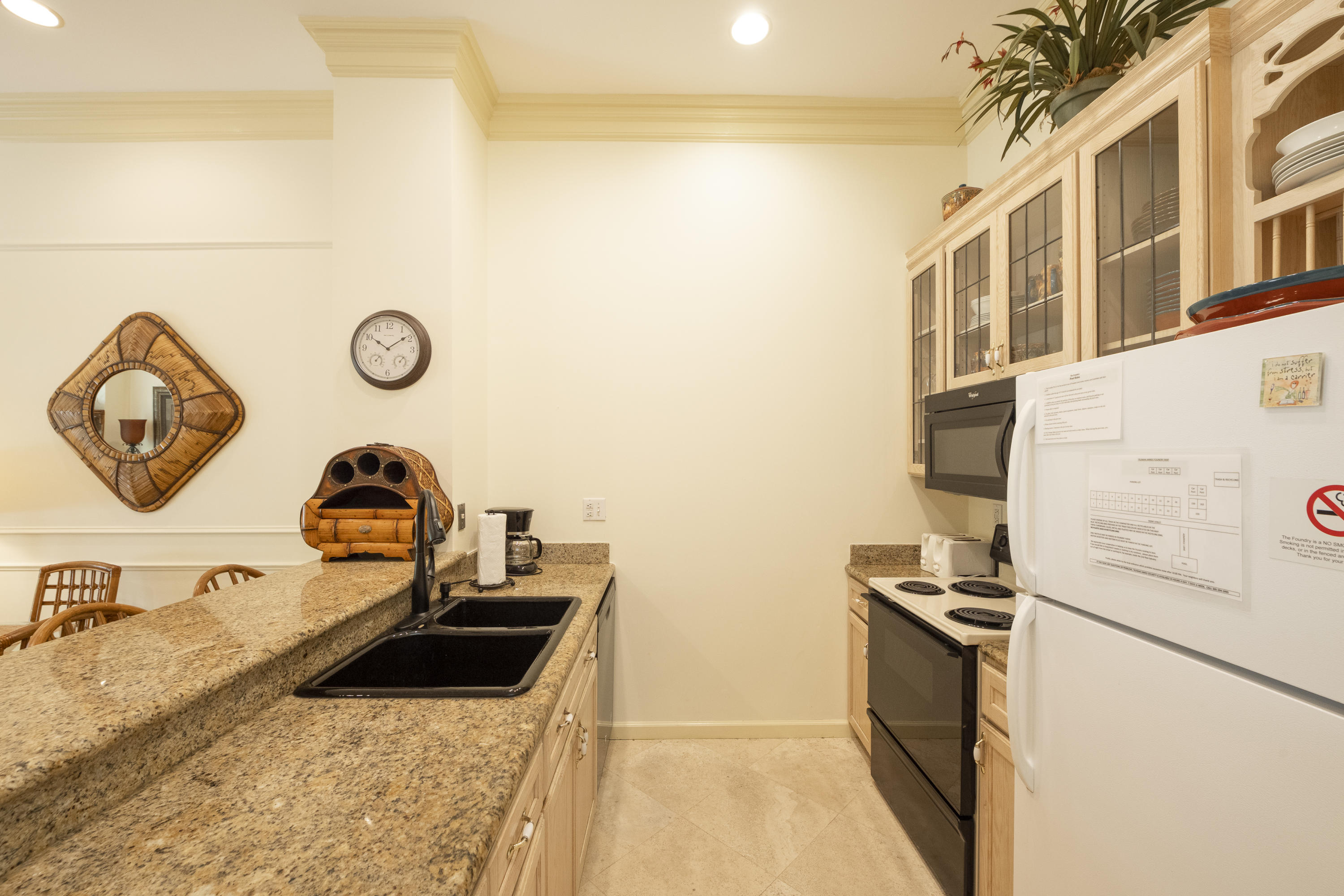 101 Front Street, Unit 5 Key West, FL 33040 - Photo 8 of 36 a kitchen with a refrigerator and a sink