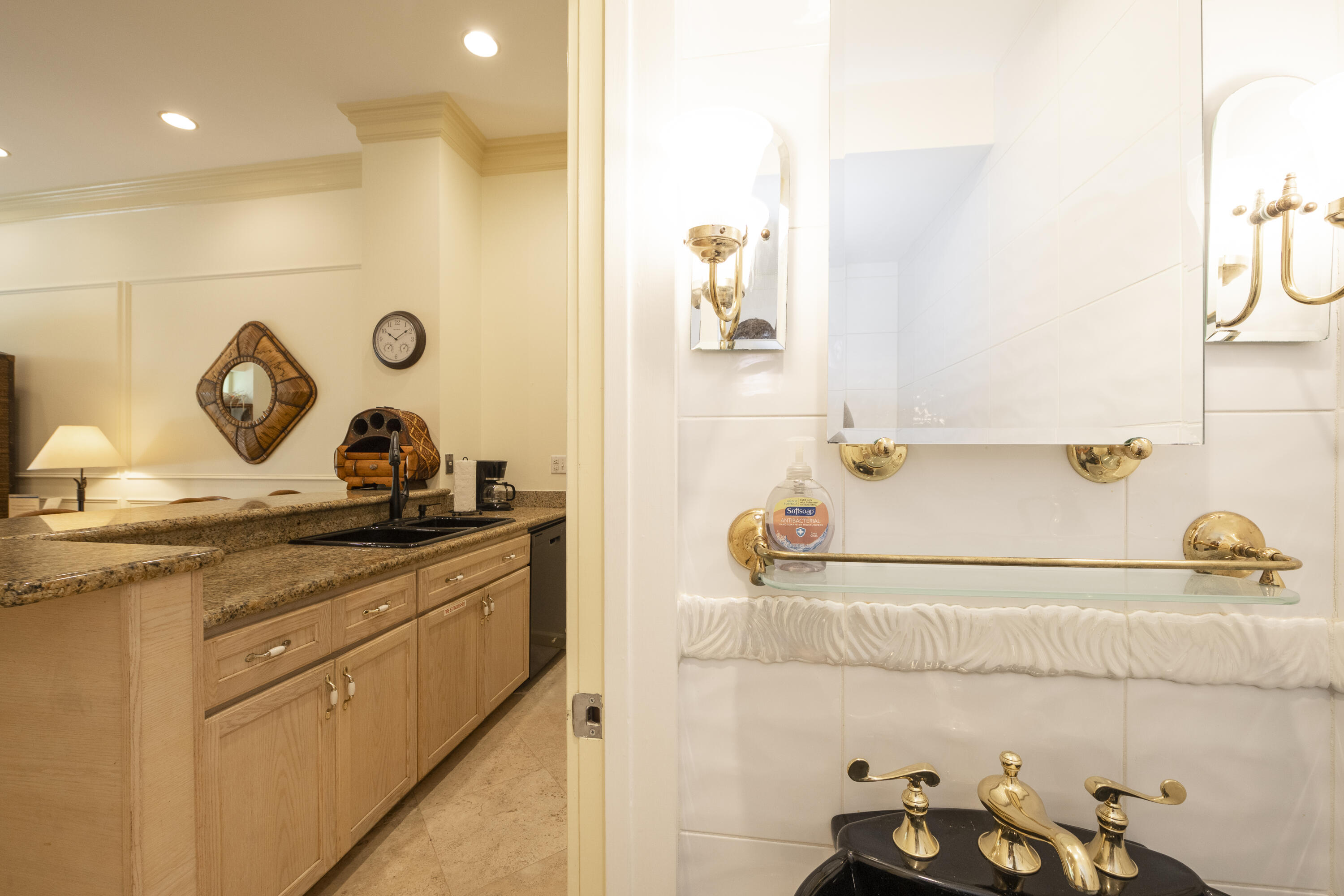 101 Front Street, Unit 5 Key West, FL 33040 - Photo 10 of 36 a bathroom with a sink and a mirror