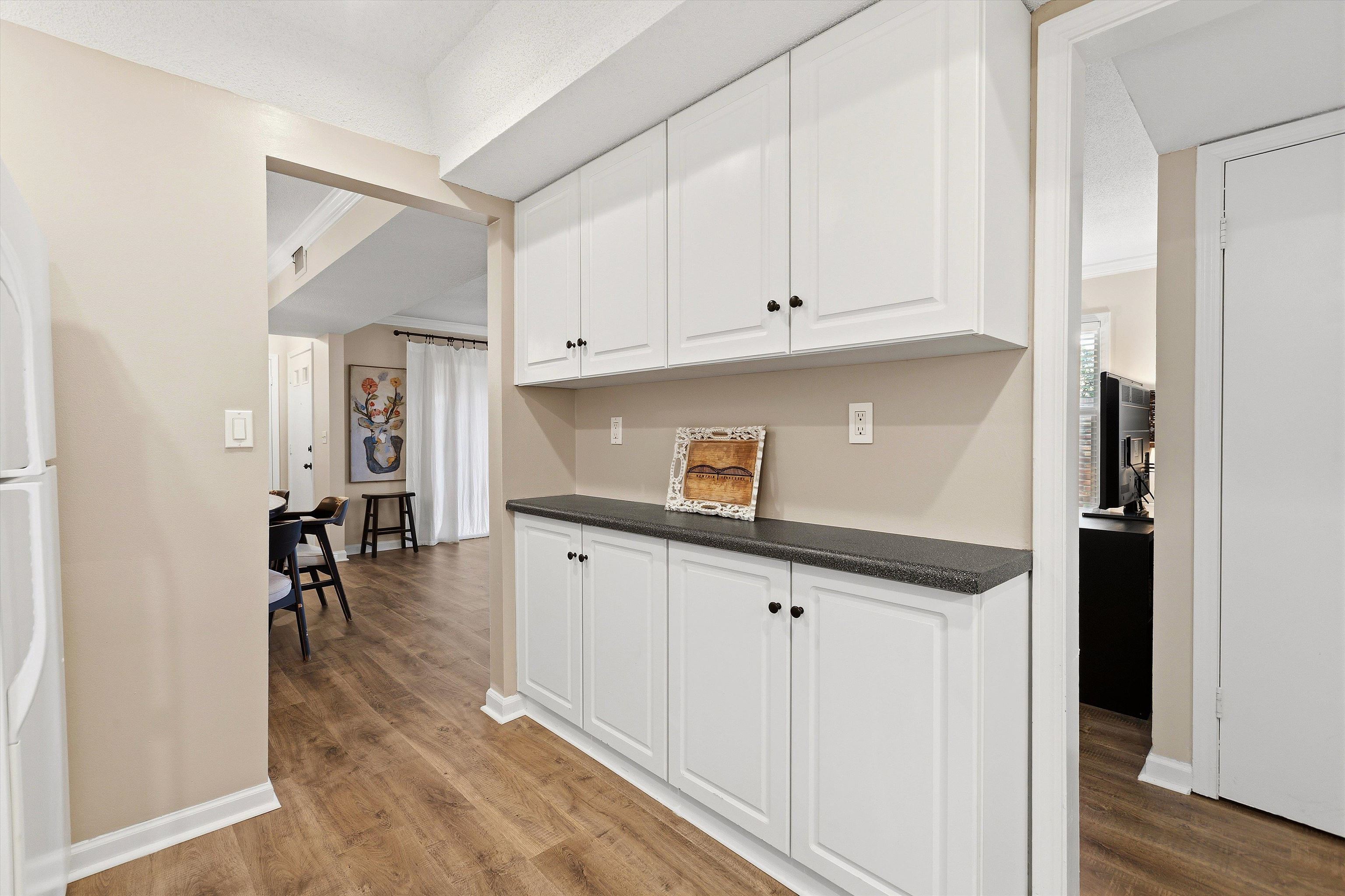 1184 Lynnfield Road, Unit 1 Memphis, TN 38119 - Photo 13 of 28 Pantry cabinets provide excellent additional storage for the kitchen.