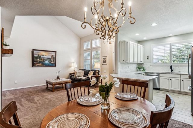 a very nice looking dining room with furniture