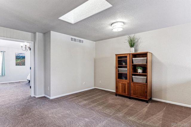 a view of a balcony with flowers