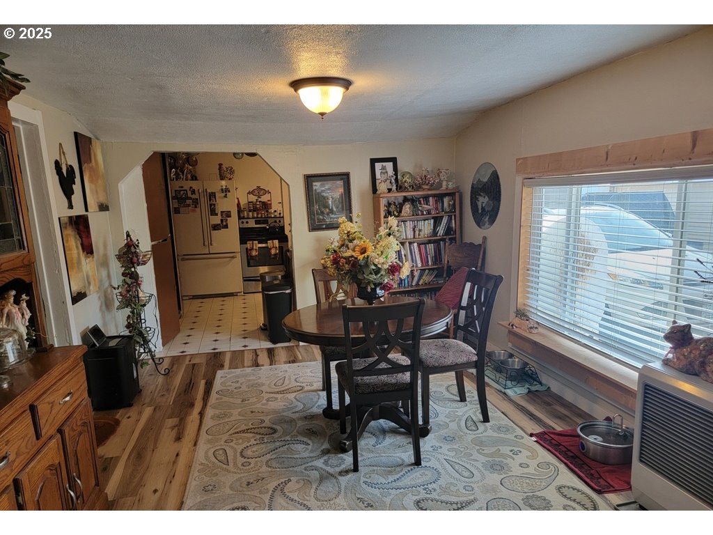 309 A Avenue Seneca, OR 97873 - Photo 12 of 35 a view of a dining room with furniture and a window