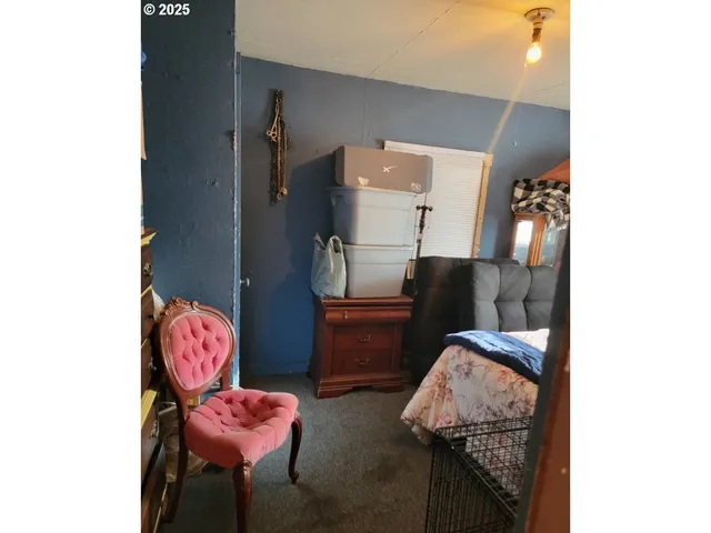 a living room with furniture and a mirror