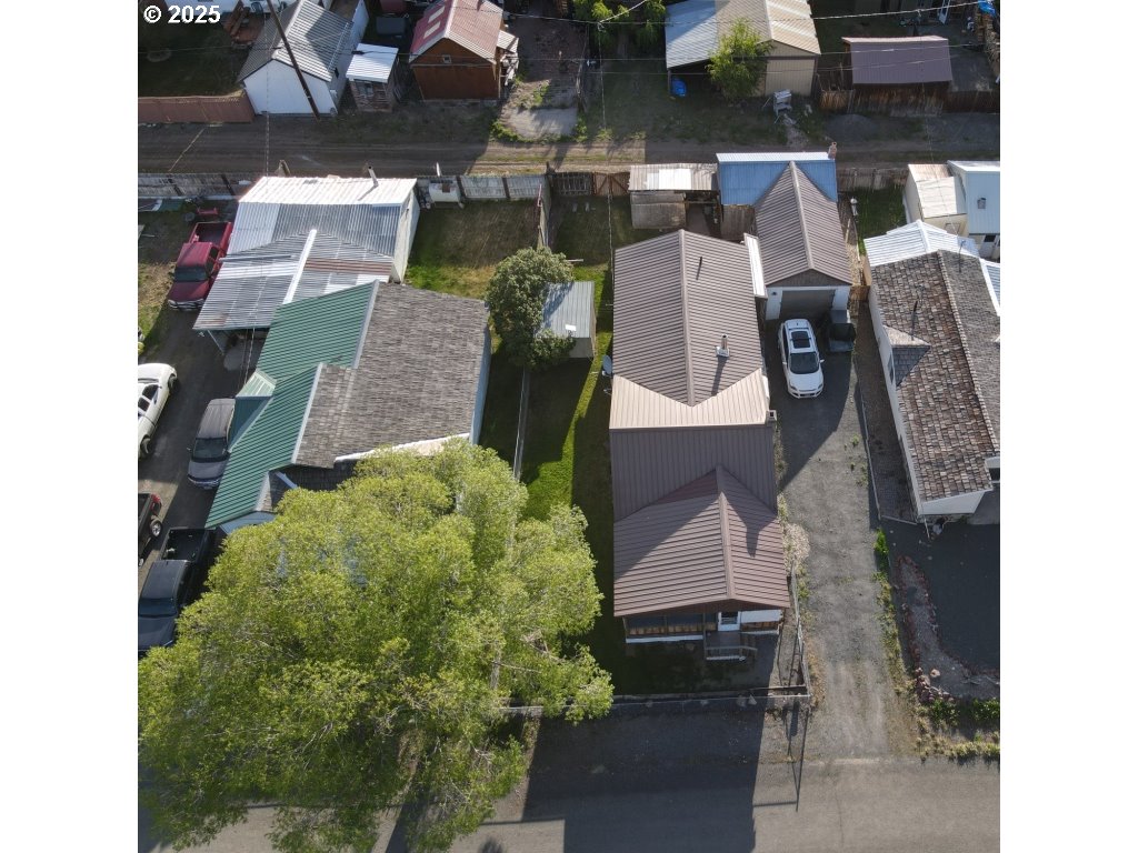 309 A Avenue Seneca, OR 97873 - Photo 3 of 35 an aerial view of residential houses with outdoor space