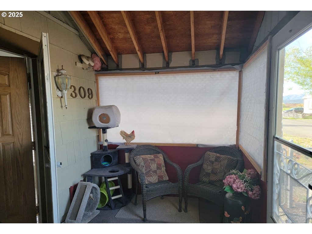 309 A Avenue Seneca, OR 97873 - Photo 4 of 35 a view of a dining room with furniture and a window