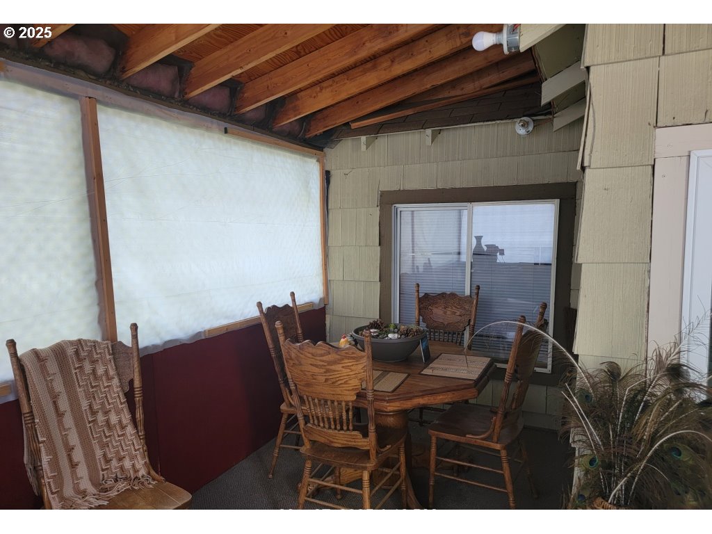 309 A Avenue Seneca, OR 97873 - Photo 7 of 35 a view of a dining room with furniture and wooden floor