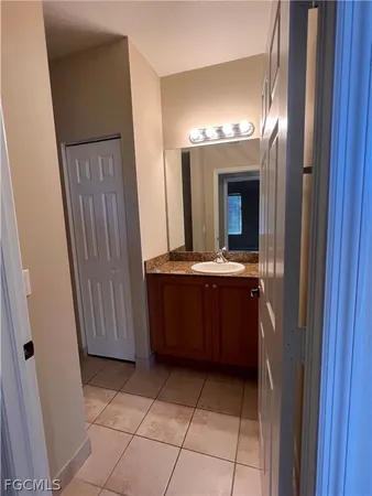 a bathroom with a vanity and a mirror