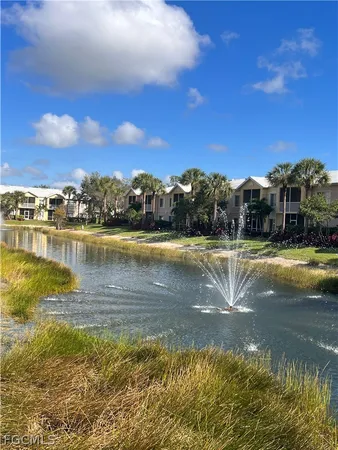 a view of a lake with houses in the background