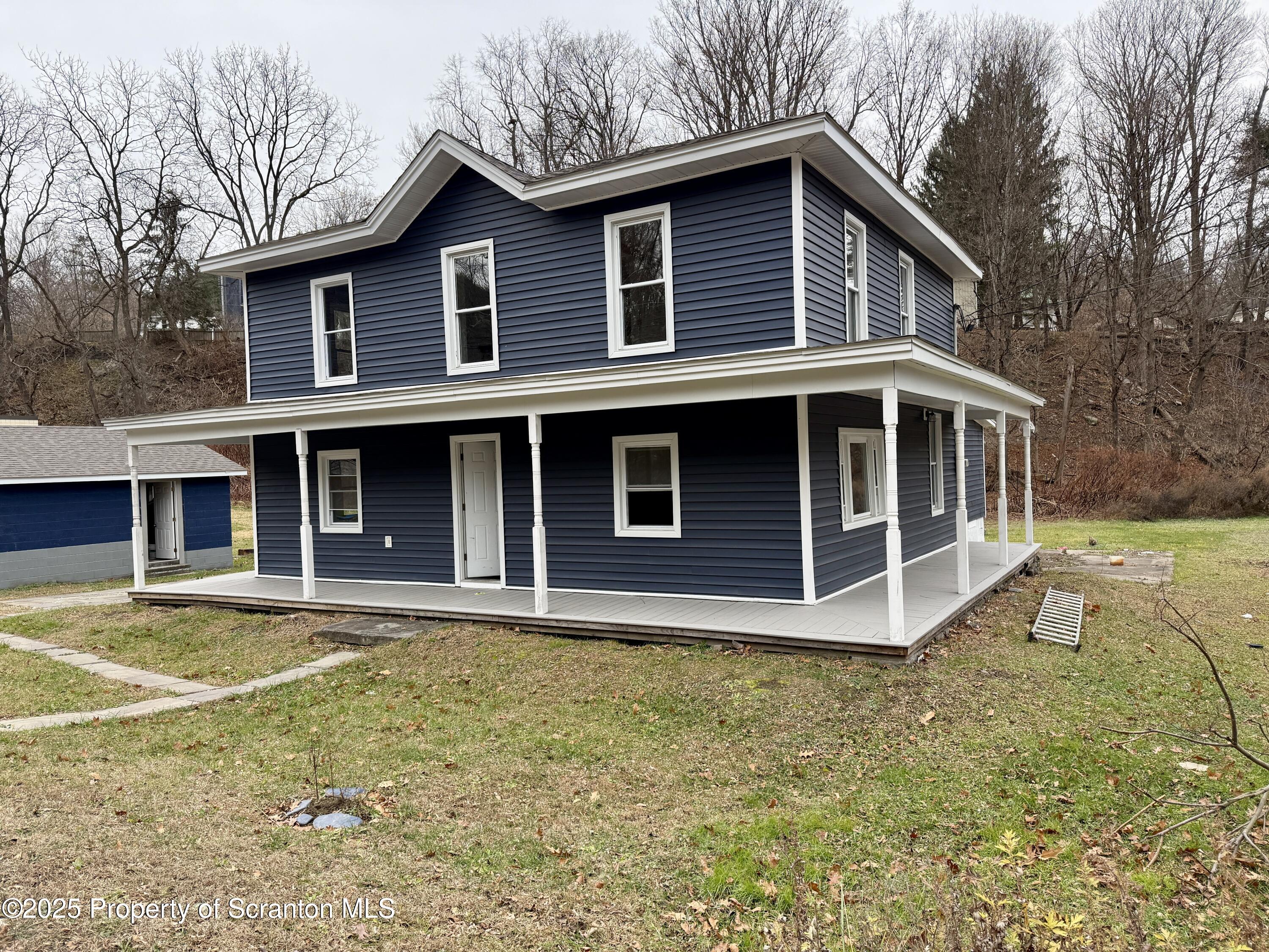 112 Mowry Road Meshoppen, PA 18630 - Photo 2 of 30 a view of a house with yard and sitting area