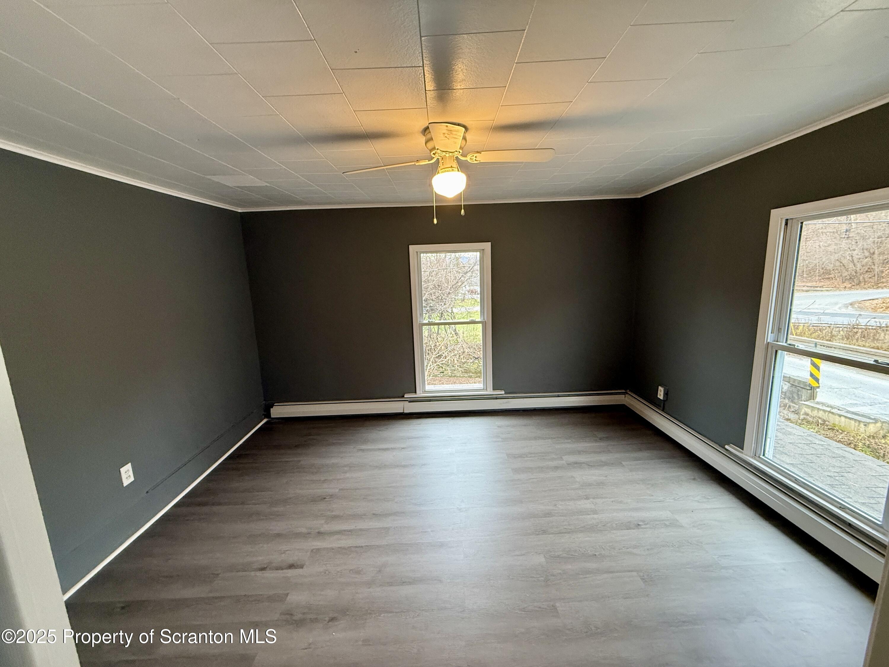 112 Mowry Road Meshoppen, PA 18630 - Photo 24 of 30 an empty room with wooden floor and windows
