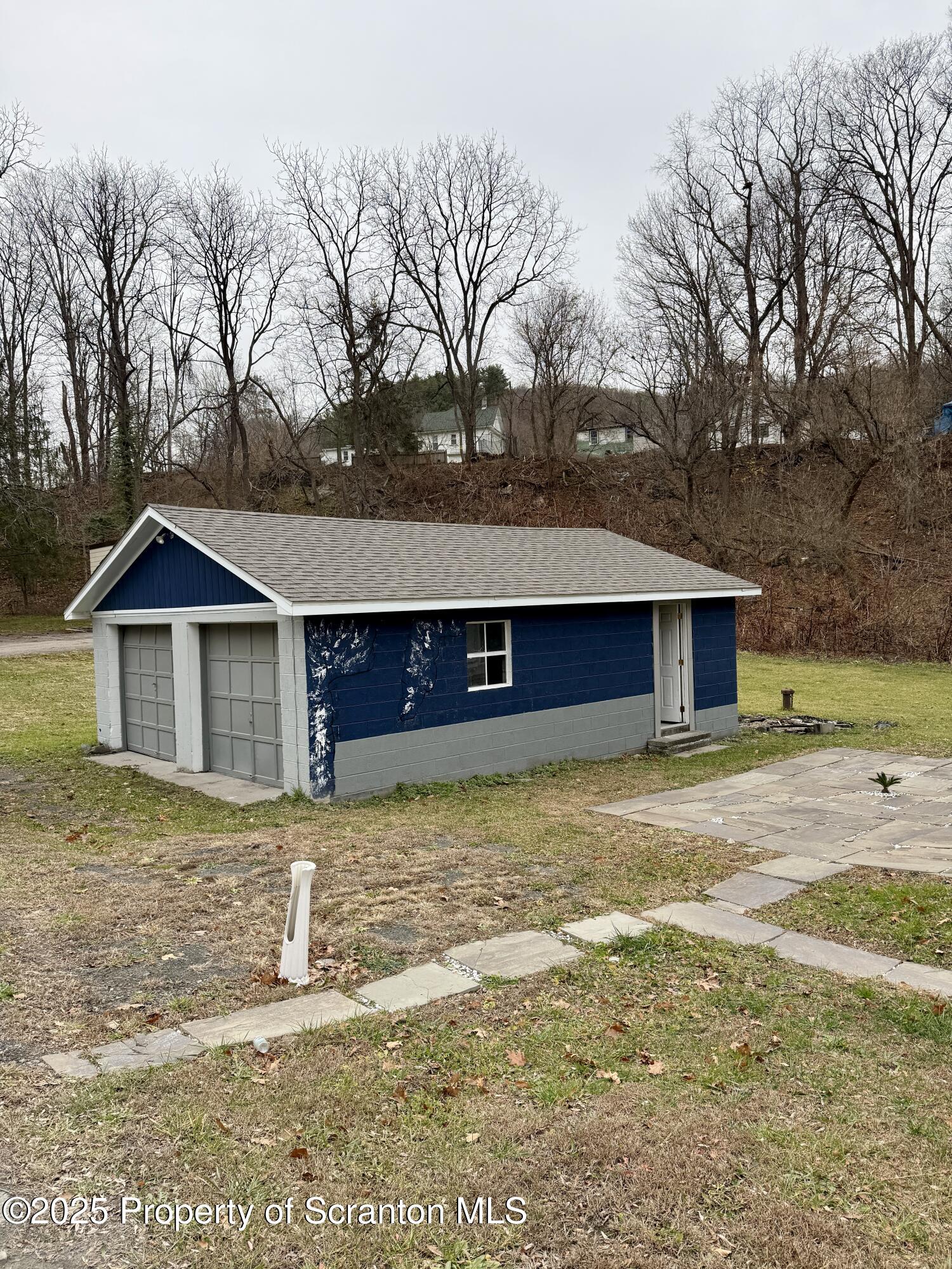 112 Mowry Road Meshoppen, PA 18630 - Photo 28 of 30 a front view of a house with garden
