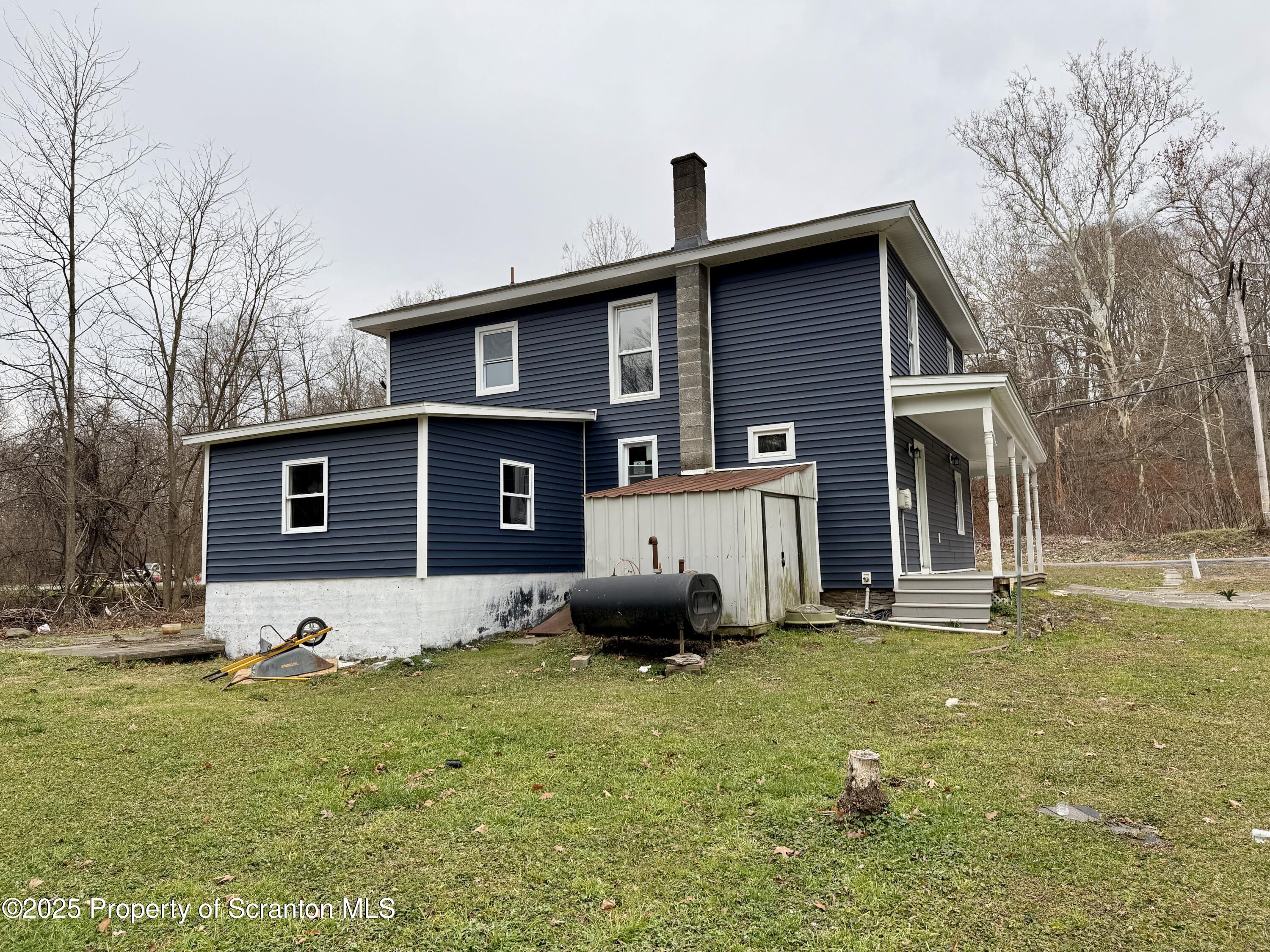 112 Mowry Road Meshoppen, PA 18630 - Photo 4 of 30 a front view of a house with a yard