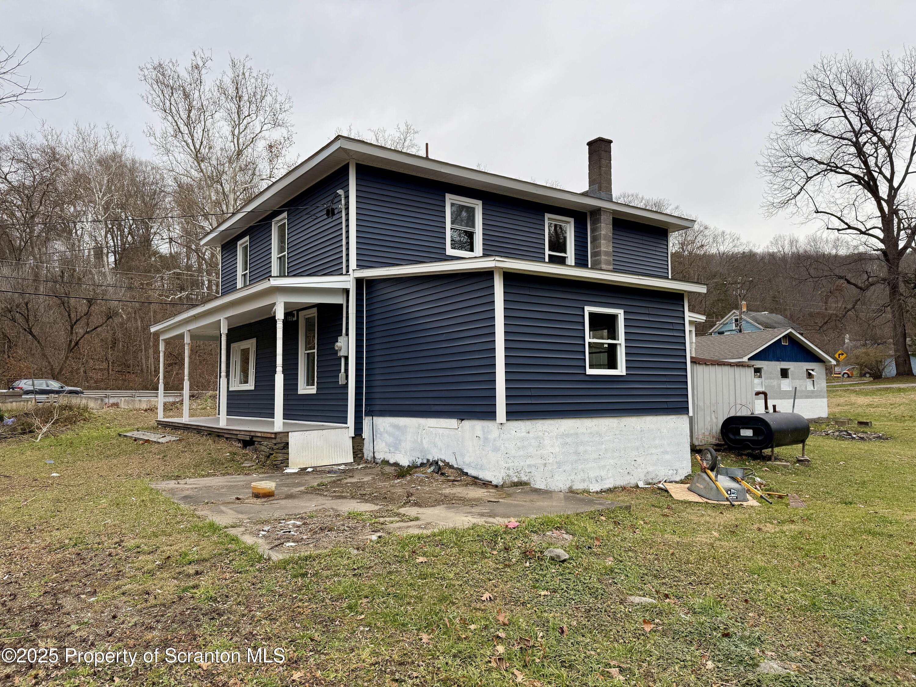 112 Mowry Road Meshoppen, PA 18630 - Photo 5 of 30 a front view of a house with a yard