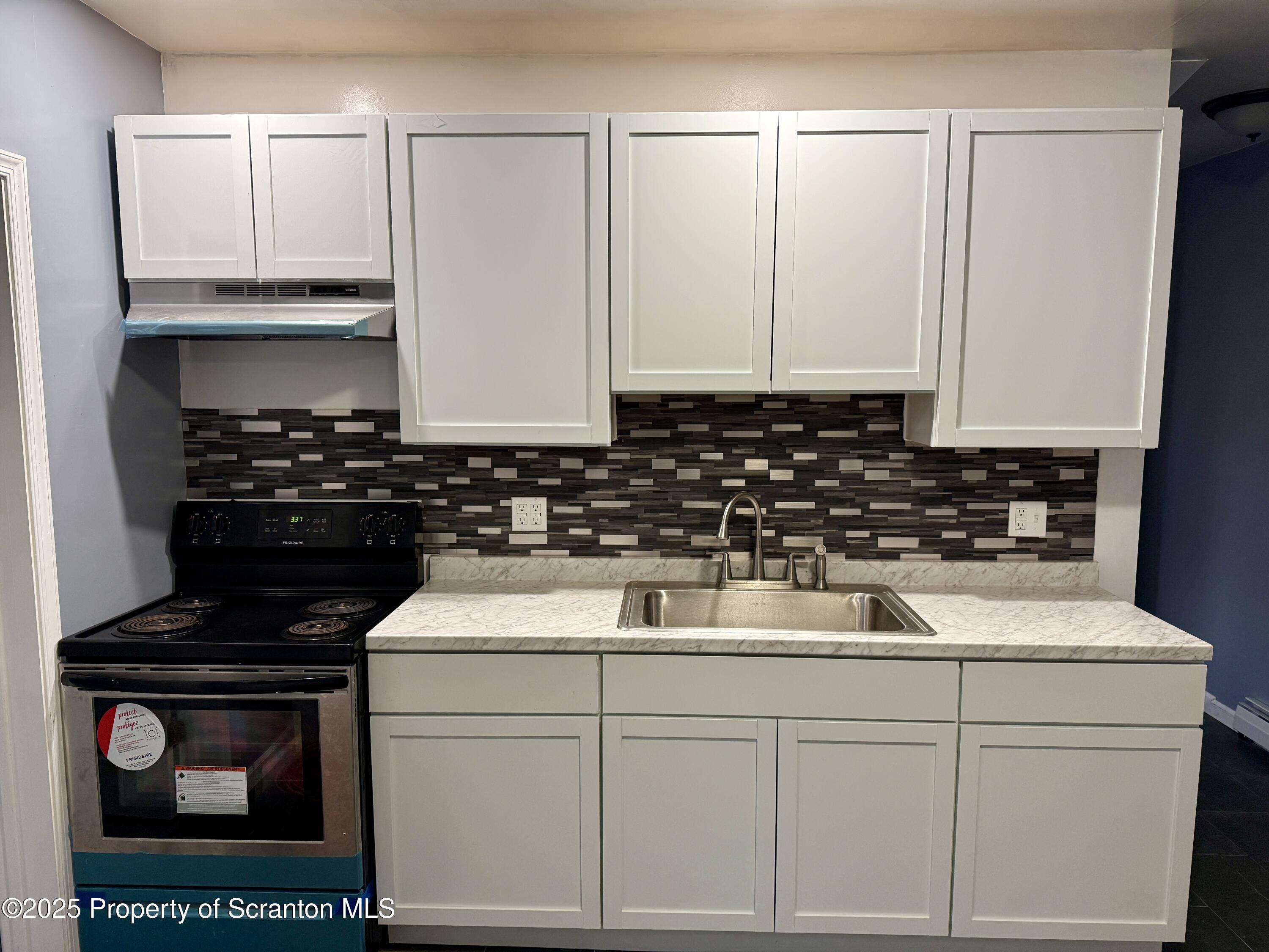 112 Mowry Road Meshoppen, PA 18630 - Photo 8 of 30 a kitchen with a sink and cabinets