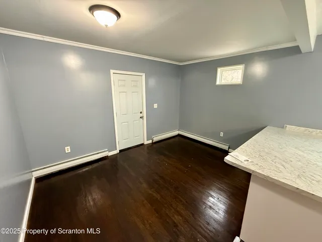 a view of workspace with wooden floor