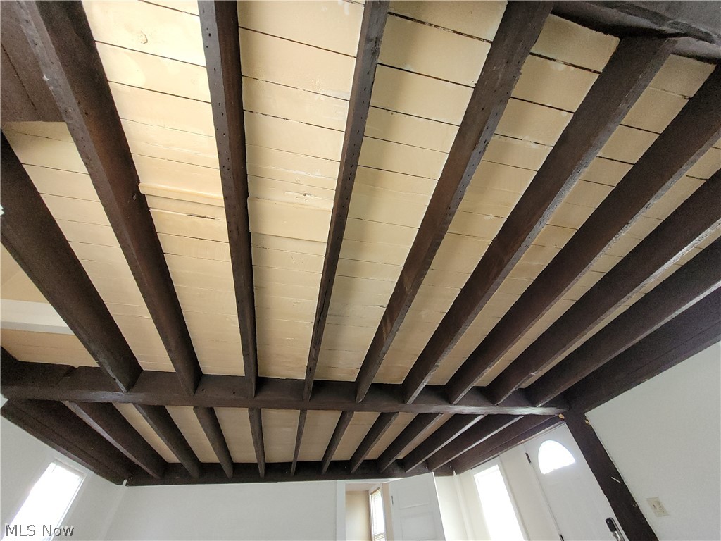 9021 Johnnycake Ridge Road Mentor, OH 44060 - Photo 13 of 32 Exposed beam ceiling in living room