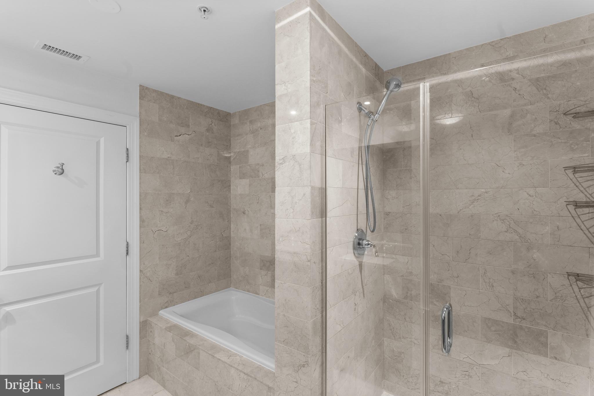 2425 L Street Northwest, Unit 431 Washington, DC 20037 - Photo 20 of 29 a bathroom with a shower and bathtub