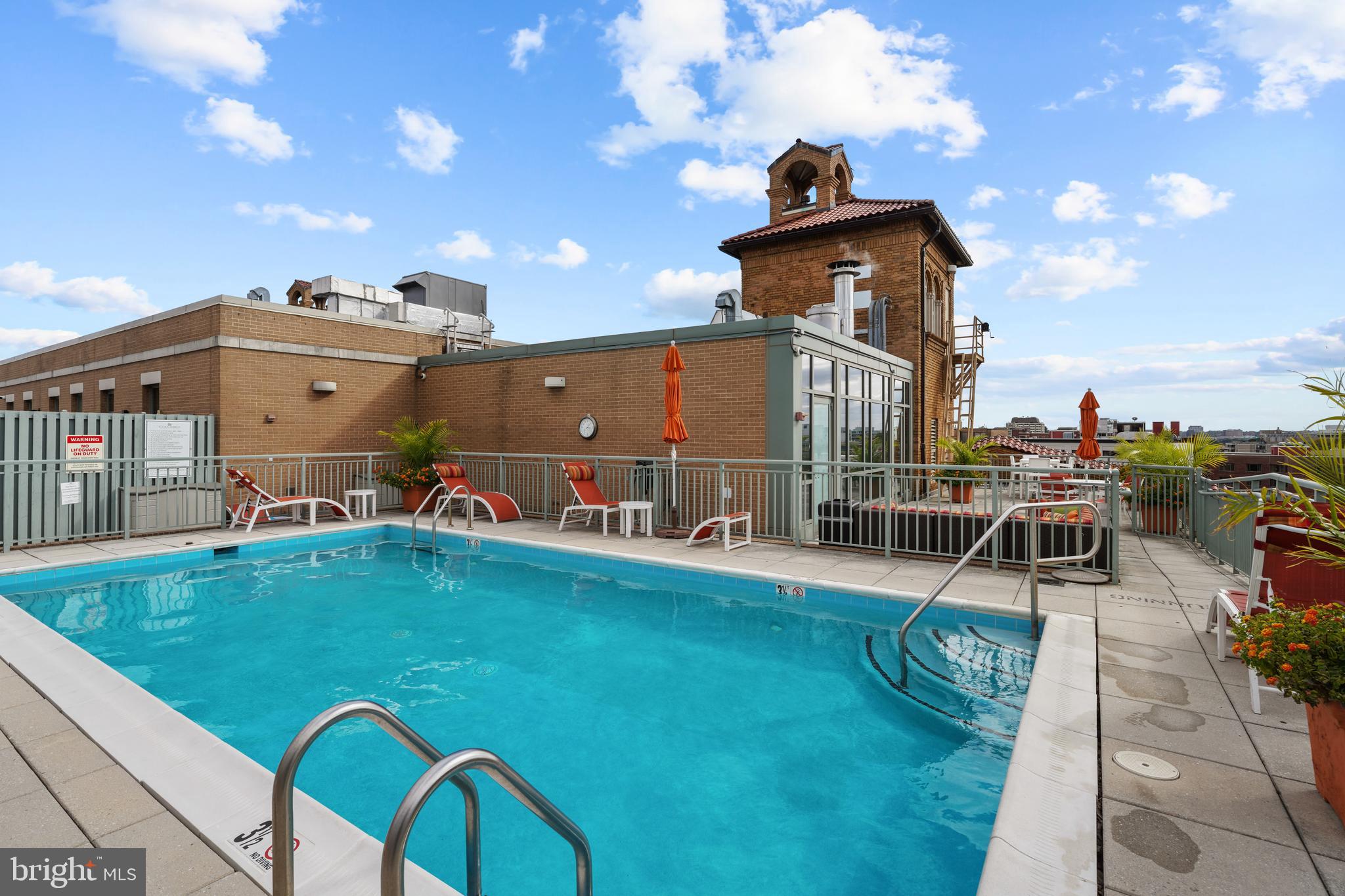 2425 L Street Northwest, Unit 431 Washington, DC 20037 - Photo 25 of 29 a view of a house with a swimming pool
