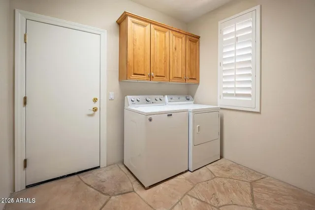 a utility room with a window dryer and washer