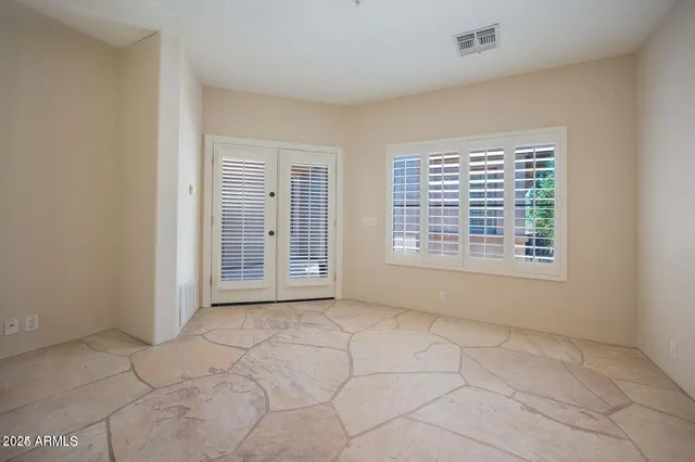 a view of an empty room with a window