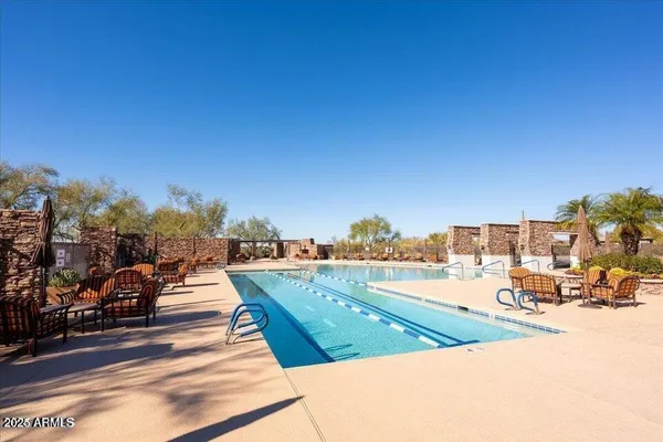 a view of a backyard with sitting area