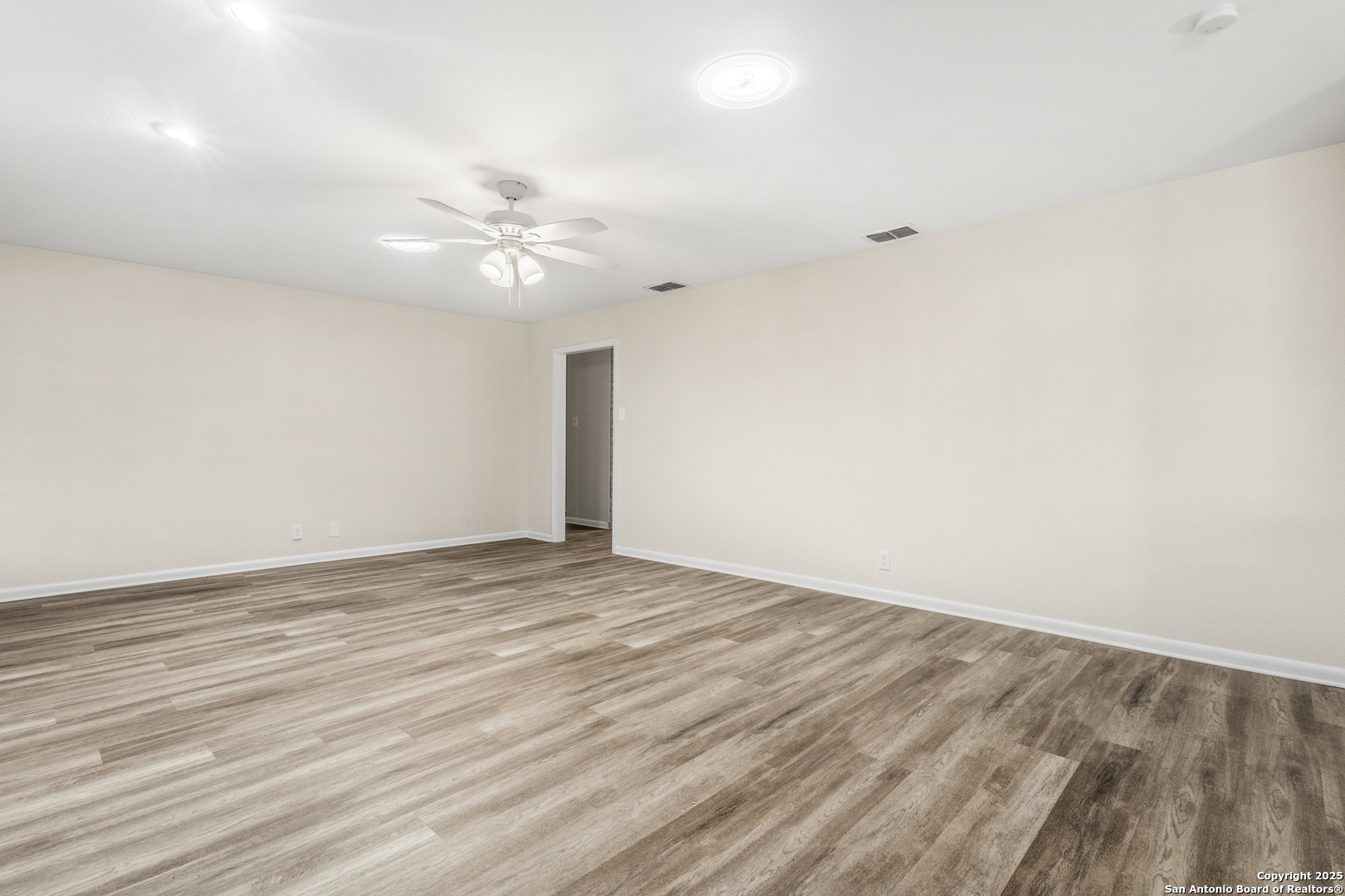 6041 Trone Trail Leon Valley, TX 78238 - Photo 11 of 30 wooden floor in an empty room